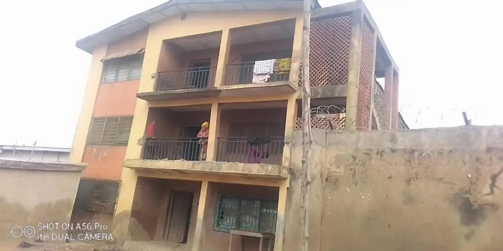 A 2-story building with 2 shops