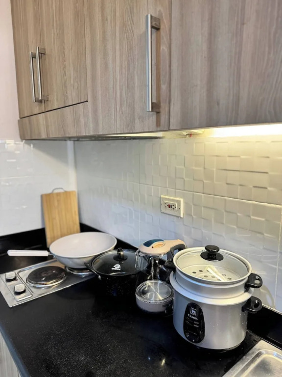 Relax in Pasay City's Best Kept Secret - Spacious Condo With Garden View