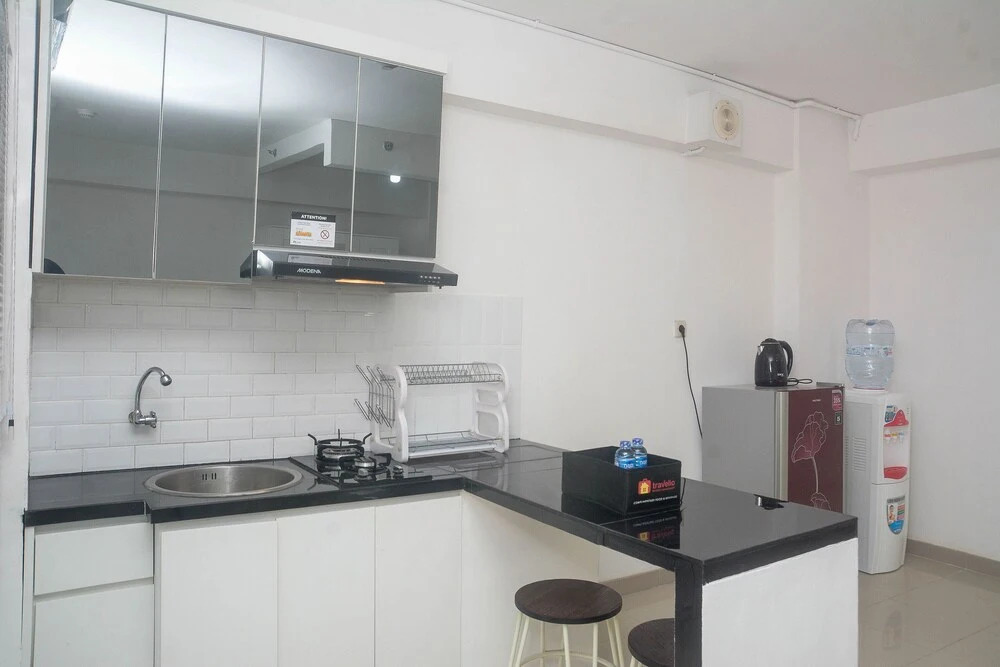 Elegant and Comfy Studio at Bassura City Apartment By Travelio