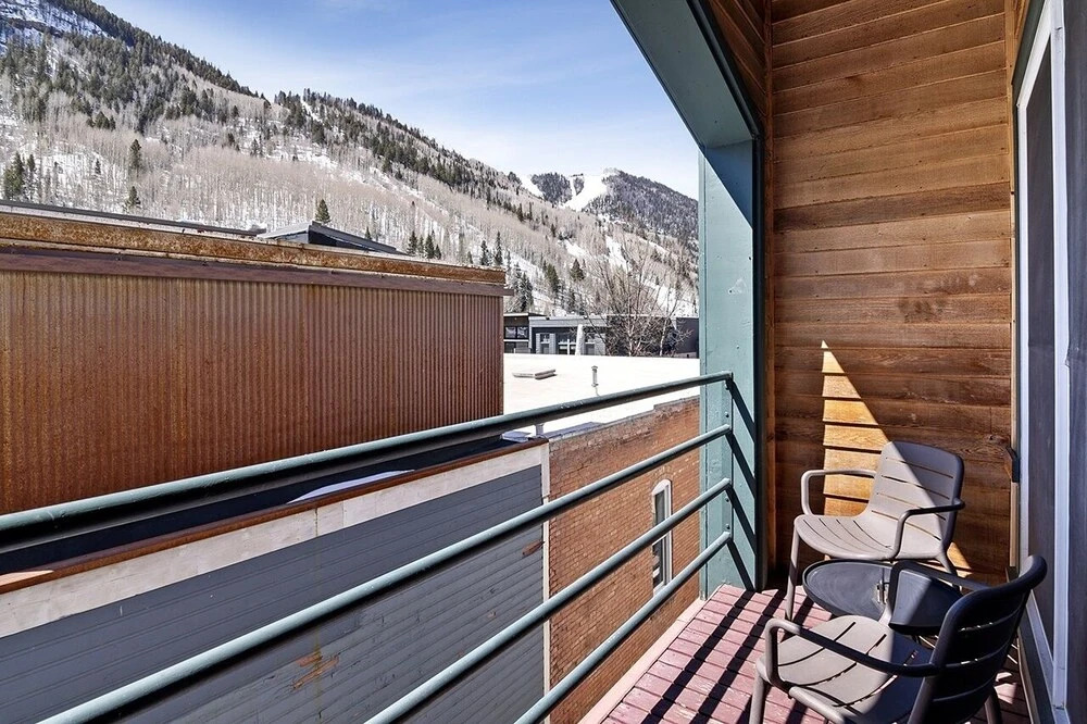 Top Floor Condo With Balcony Steps To Lifts & Main Street 2 Bedroom Condo by RedAwning