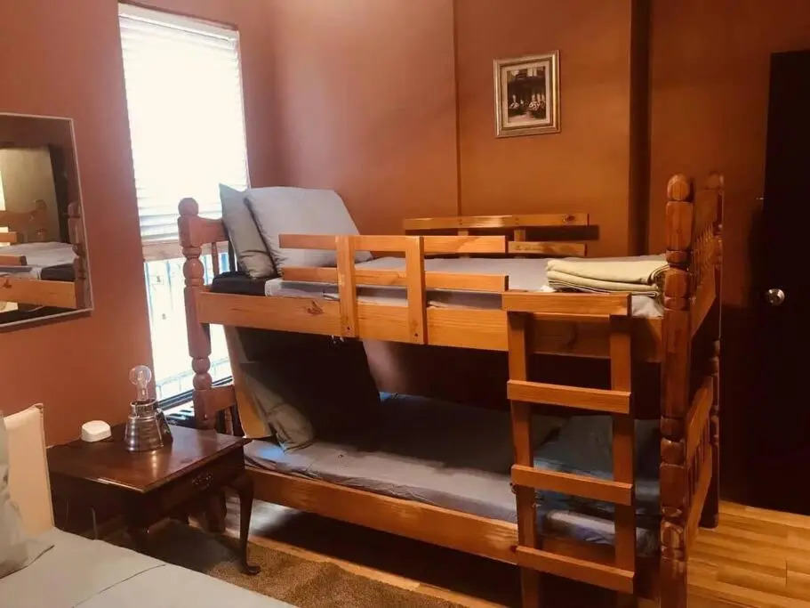1850s historic Row House 7min train to NYC with private backyard