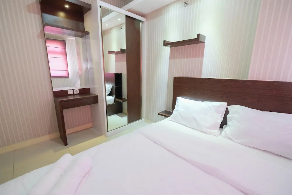 Homey and Relaxing 2BR Green Pramuka Apartment