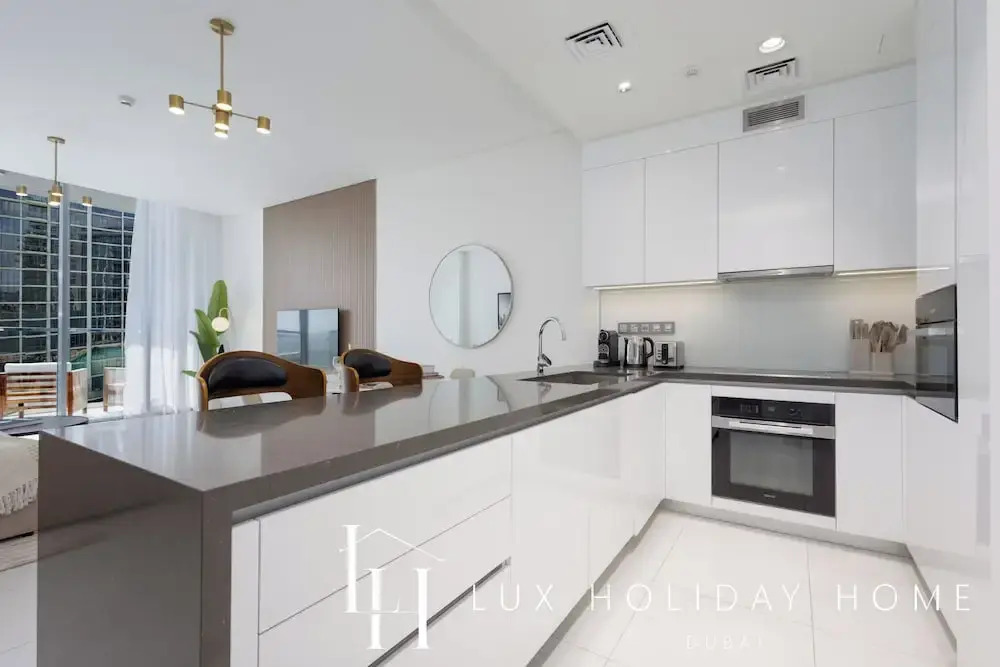 LUX | 2BR Lagoon View – District One, 10–15 min Burj Khalifa
