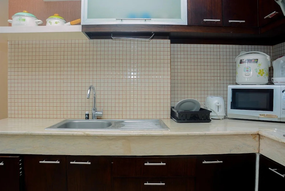 Modern 2 BR Apartment @ FX Residence with City View By Travelio
