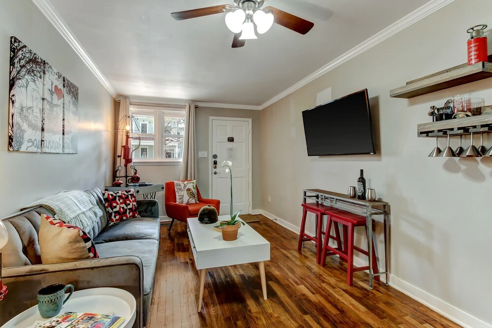 Vibrant, Colorful Condo Building With Backyard Firepit and Games