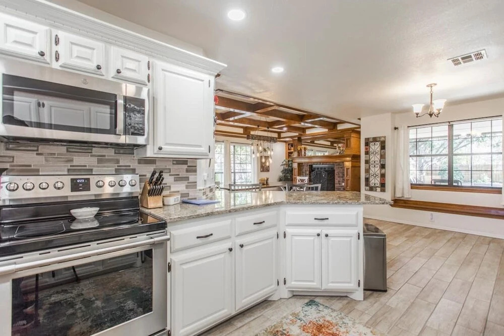 Spacious Retreat With Shaded Yard & Games 4 Bedroom Home by RedAwning