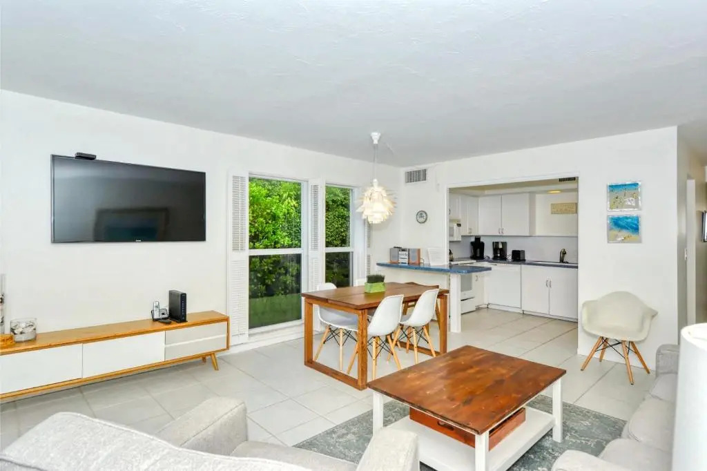 LaPlaya 101A Step out to the beach from your screened lanai Light and bright end unit