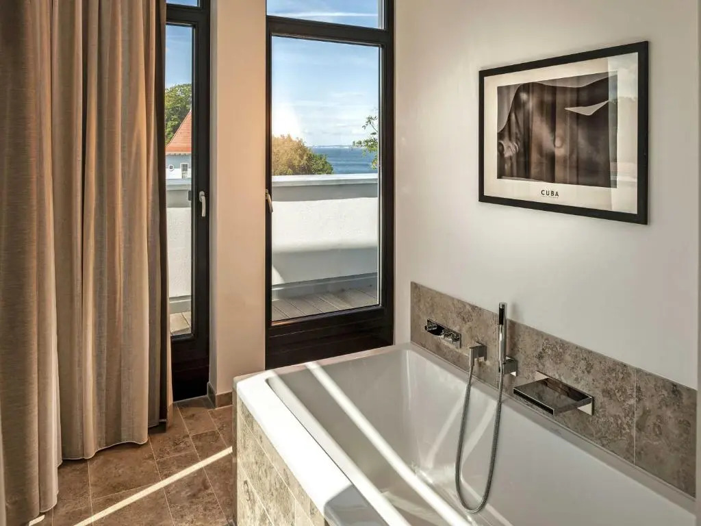 Villa Philine - Penthouse 28 mit Panoramablick, Pool, SPA & Kamin