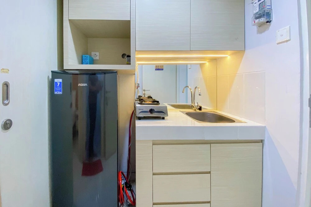 Nice and Cozy Studio at Amartha View Apartment By Travelio