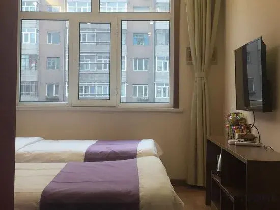 Xinyue Hotel (Mudanjianghuochebeizhanxinhualudian)