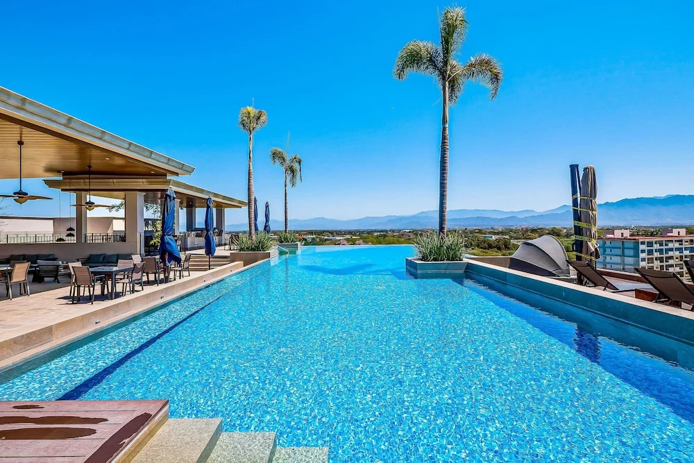 Mountain-view Apartment Near Beach With Balcony, Rooftop Pool, Gym, & Ping-pong