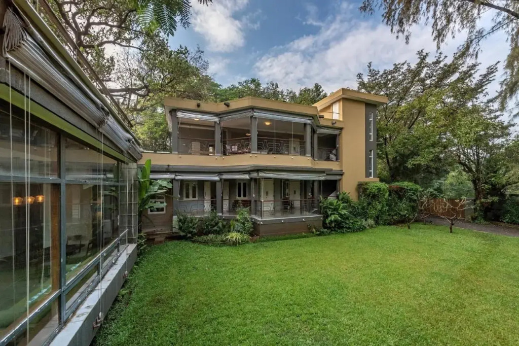 SaffronStays Odeon - 4BR heritage art deco villa with cantilever pool, verandahs & forested lawns