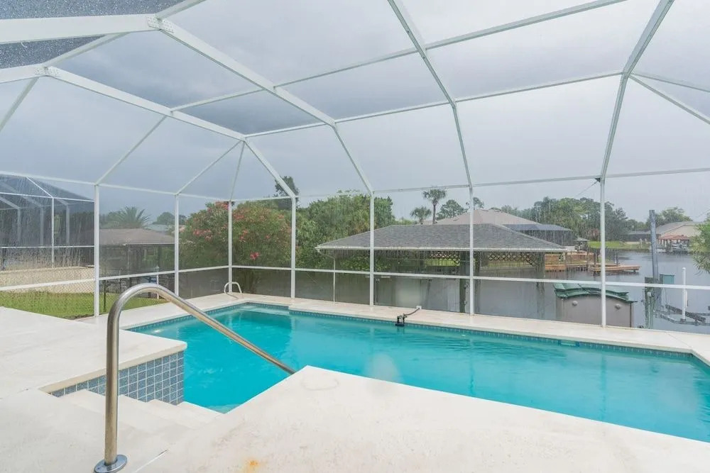 Peaceful Waterfront Pool Home 3 Bedroom Home by RedAwning