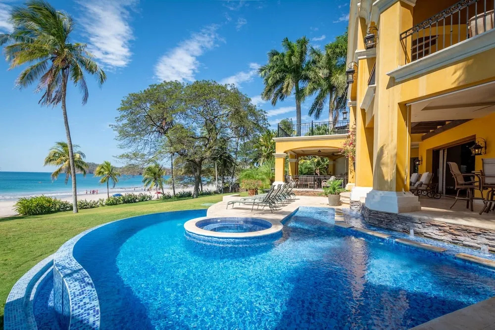 Elegant Mediterranean-Style Mansion with Beachfront Views and Private Infinity Pool