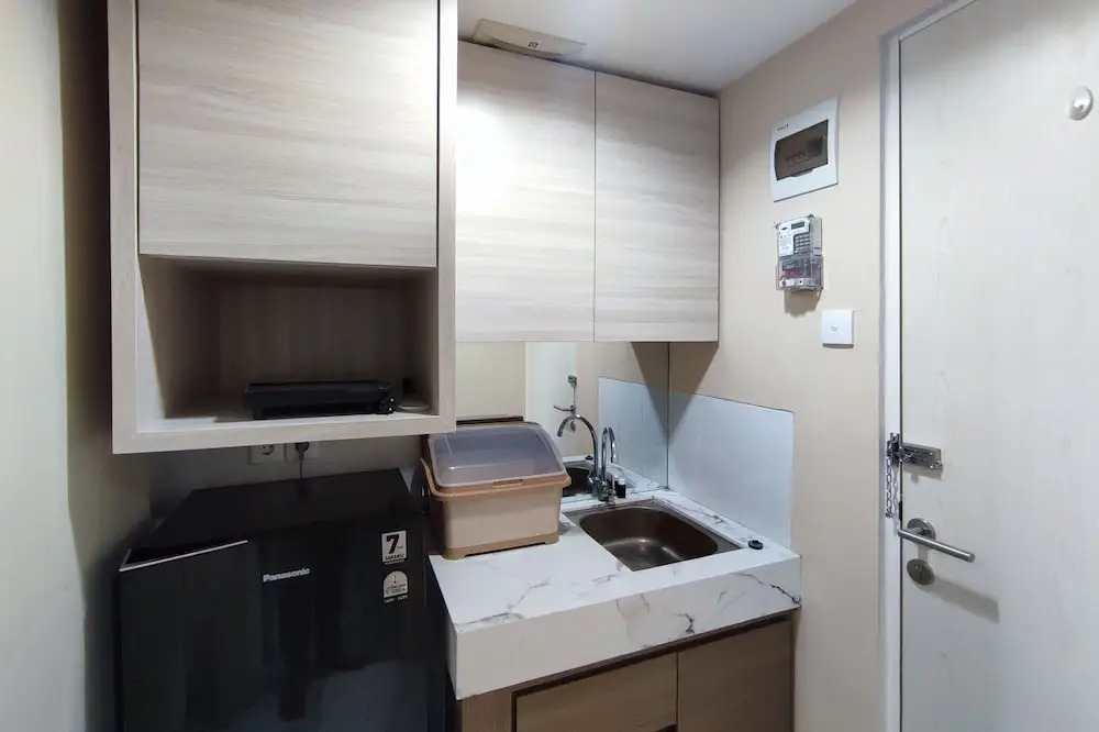 Homey 1BR without Living Room at Amartha View Apartment By Travelio