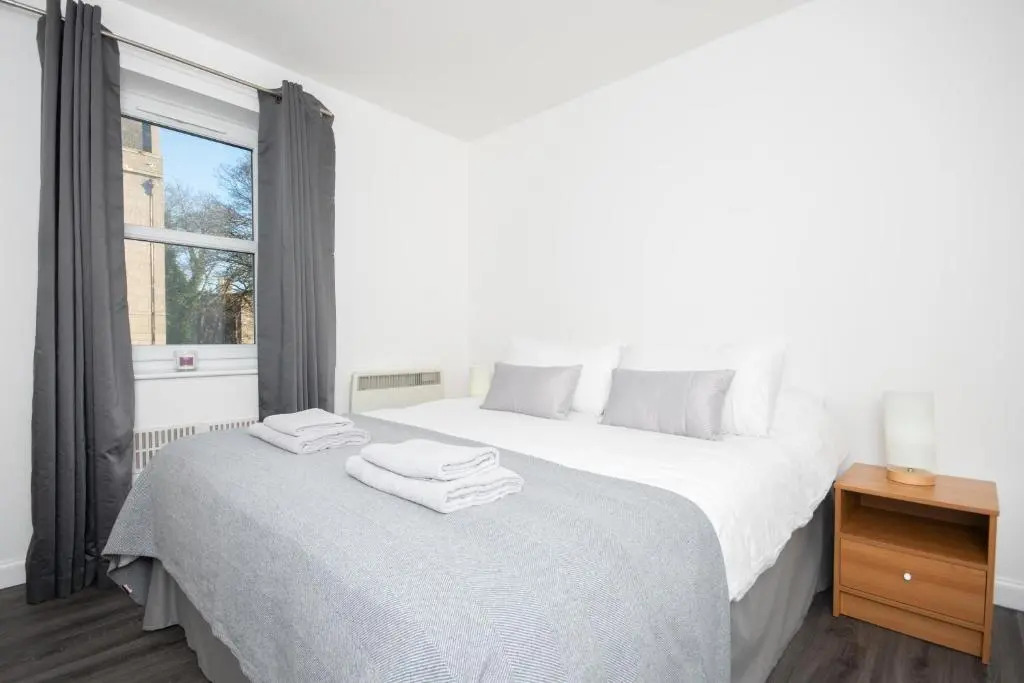 Find "DWELLCOME HOME Ltd" site for 10oo10 assurance from past guests - Immaculate Central 2 bedroom King & Double 1st floor Apartment with free allocated auto barrier off street parking, fast broadband Miles better than a hotel