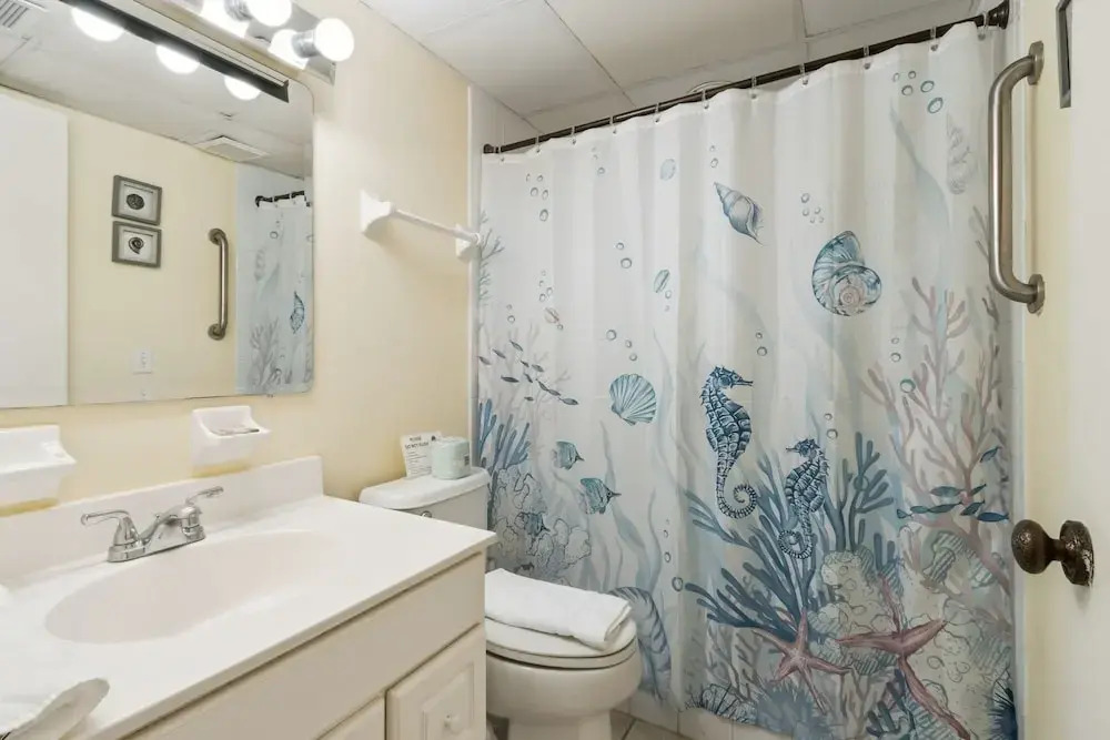 Oceanfront Beach Condo with Private Balcony, Short Walk to Pool and Beach by RedAwning