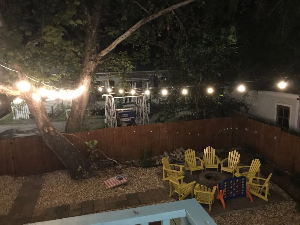 Vibrant, Colorful Condo Building With Backyard Firepit and Games