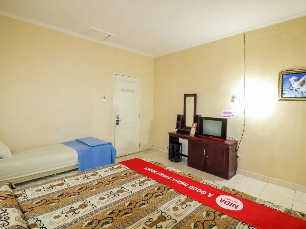 Nida Rooms 9 Kraton Tugu Railway Station at Hotel Queen Star