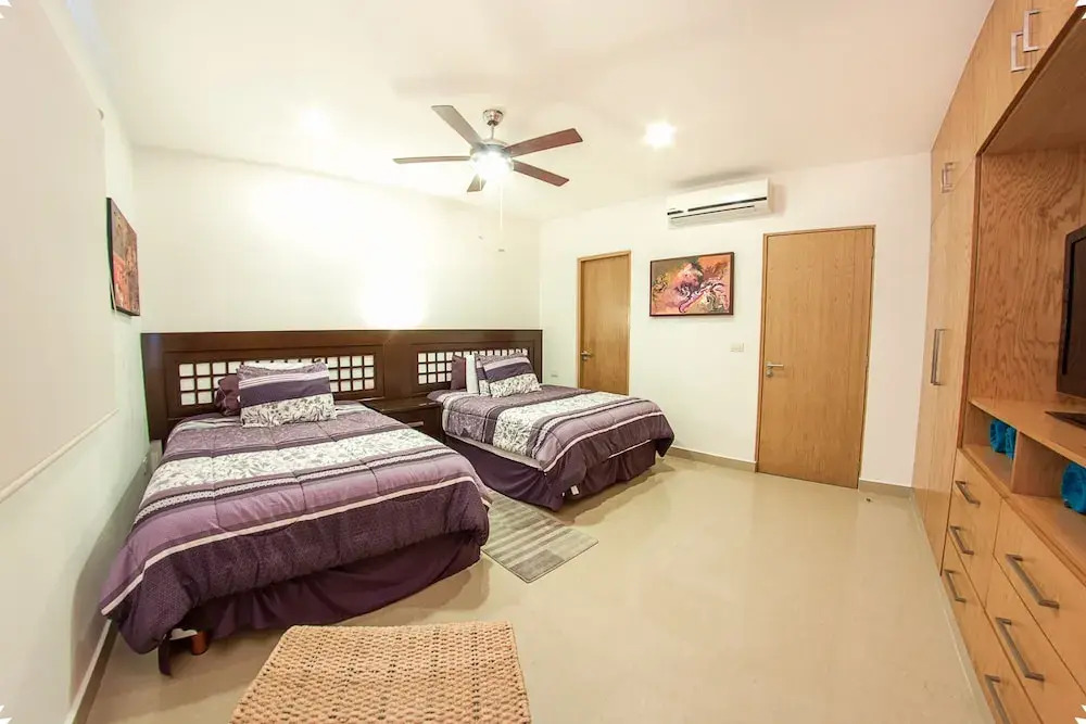 Fun and Relaxing  2BR PH steps away from the beach by Happy Address