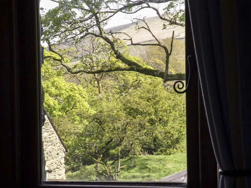 Oak Tree Cottage nestled in the hills of the Lake District and Yorkshire Dales
