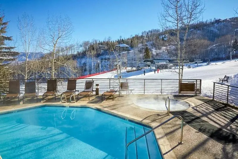 Spacious Ski in, Ski out 3 Bedroom Vacation Rental Next to the Gondola Featuring Slopeside Heated Outdoor Pool and Hot Tub