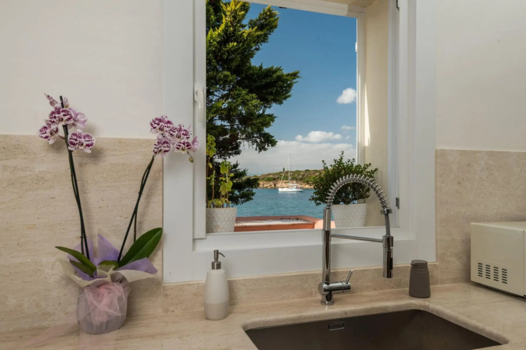 It features a large living area with fully equipped open kitchen and access to the covered terrace d-S'ABBA 1