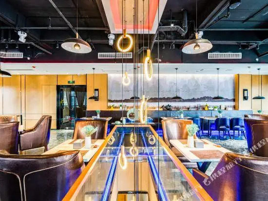 Отель Xinyi Holiday Hotel Puyan Road