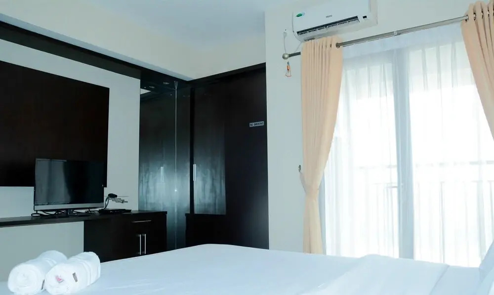 Simply Studio Room Atria Residence Apartment near Summarecon Mall By Travelio