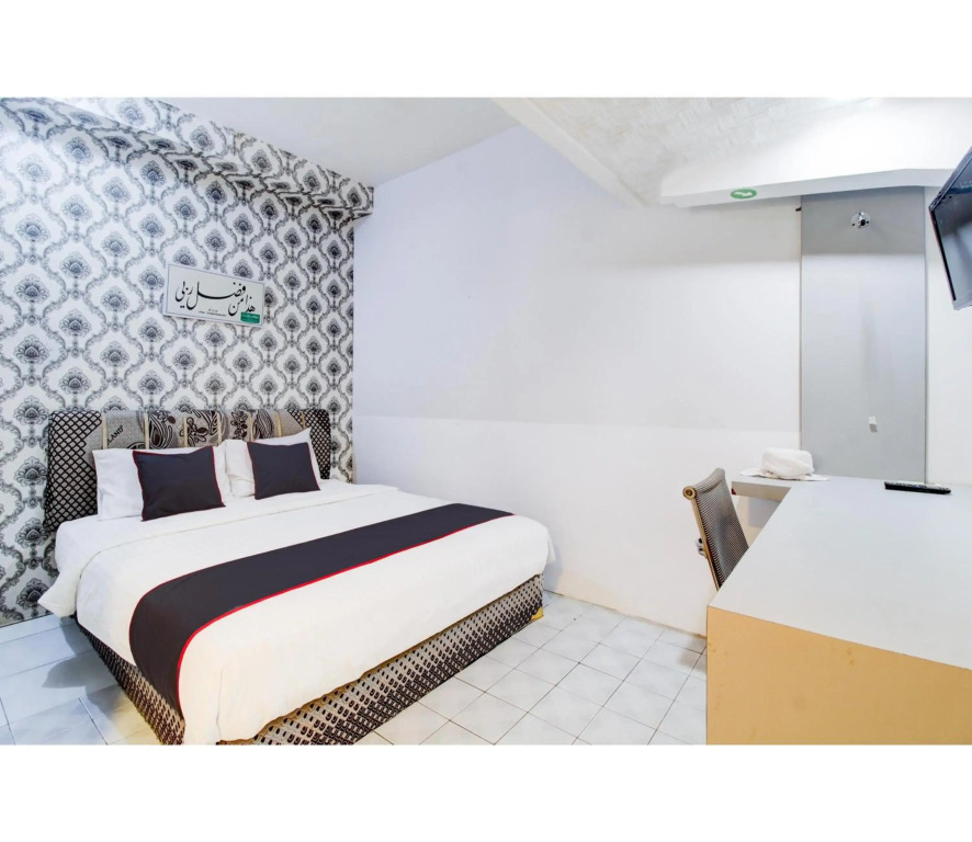 Hotel O Jalan Jenderal Sudirman Near Imam Bonjol Square Formerly Nelvi Guest House
