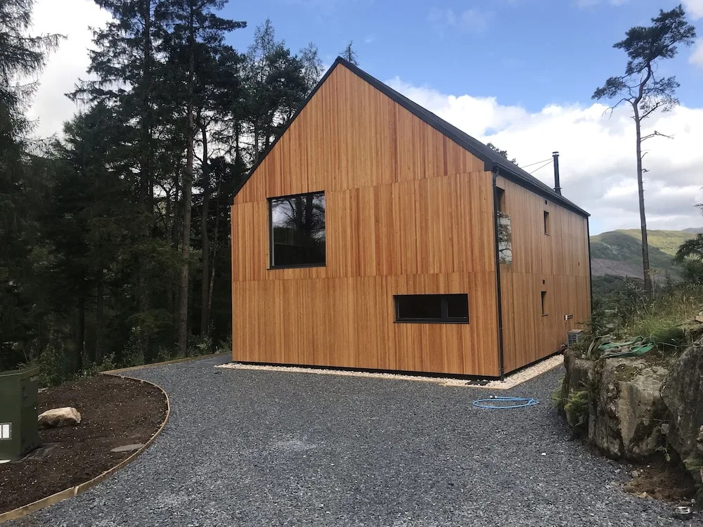 Red Stag with stunning loch and waterfall view