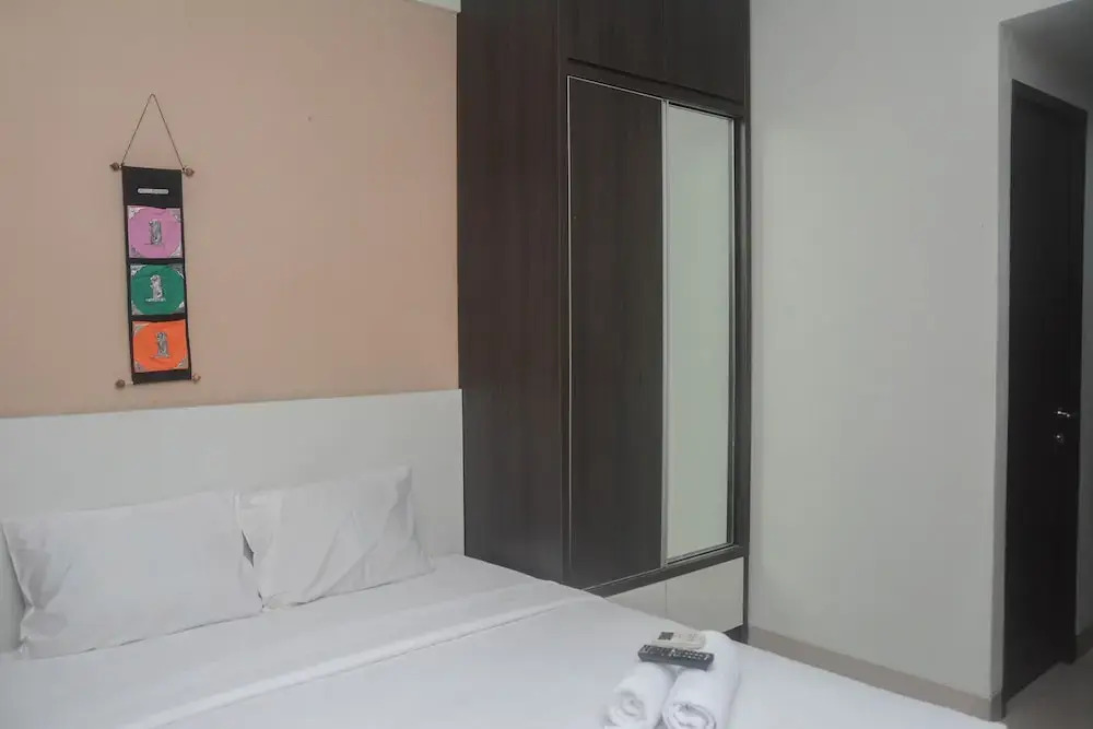 Minimalist and Comfy Studio at Grand Dhika City Apartment By Travelio