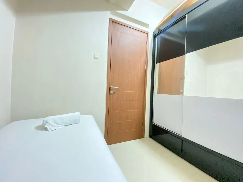 Cozy 2BR at Pinewood Apartment By Travelio