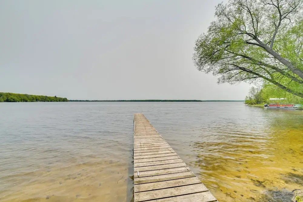 Cozy Carp Lake Cottage w/ Dock, Kayaks & Fire Pit