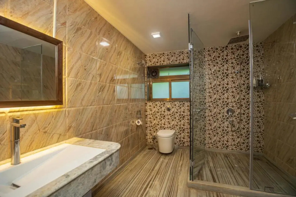 SaffronStays Aura - 4BR luxury pool villa with gym, BBQ deck, lawns & indoor games near Kihim Beach