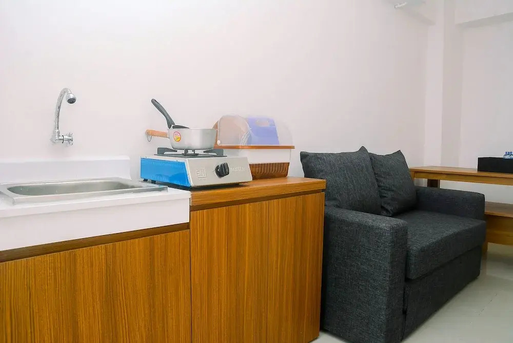 2BR Minimalist Bassura City Apartment By Travelio