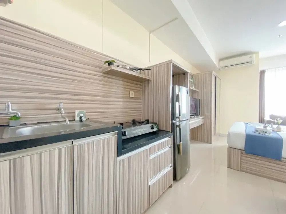 Modern and Homey 1BR without Living Room at Grand Kamala Lagoon Apartment By Travelio
