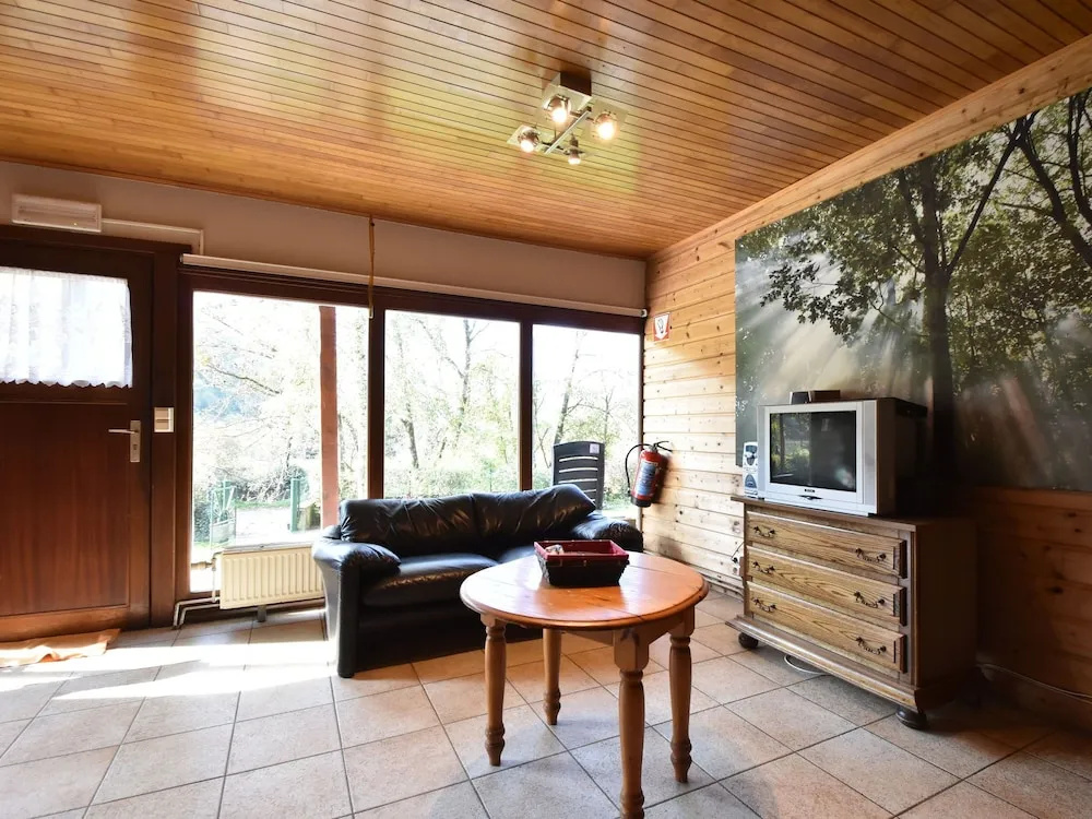 Nestled In A Green Scenery, This Chalet Along The River Is Perfect To Chill Out!