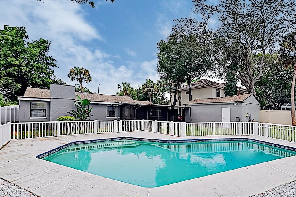 Updated W/ Gated Pool & Screened-in Porch 4 Bedroom Home