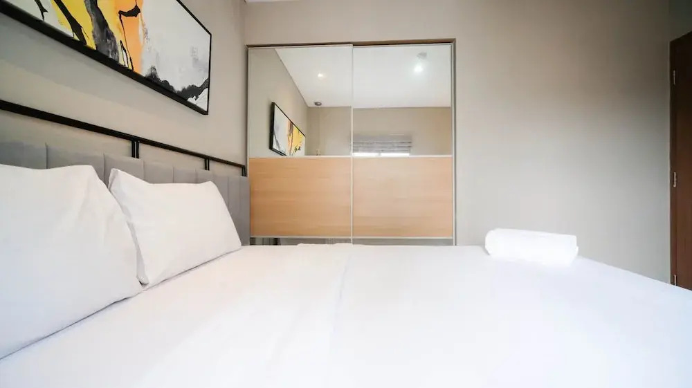 Minimalist and Beautiful 1BR with Extra Room at Pavilion Permata Apartment By Travelio