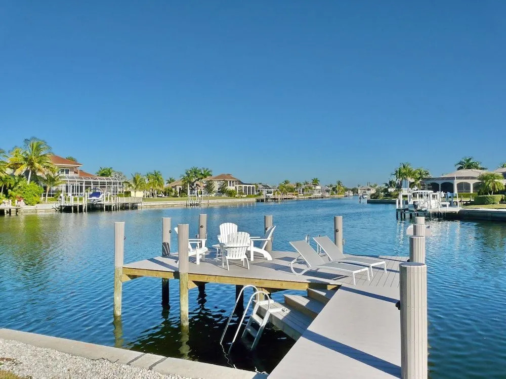 Waterfront home on key lot with pool, spa and views