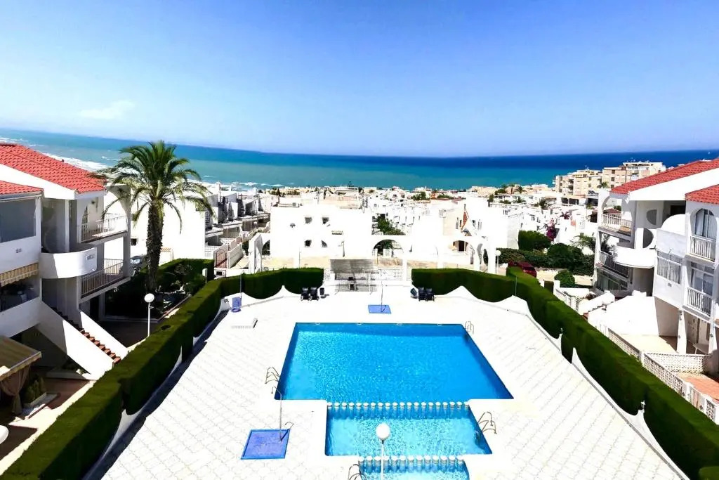 Apartment with pool, sea views & balcony less than 10min walk to La Mata Beach!