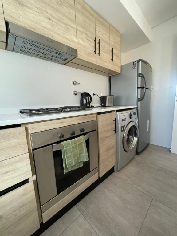 Departamento Moderno - Equipado y Con Cochera Privada