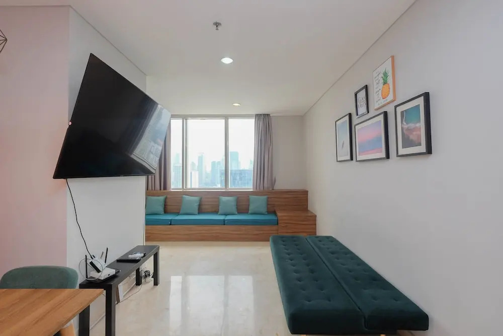 Luxury and Strategic 1BR Apartment at The Empyreal Epicentrum By Travelio