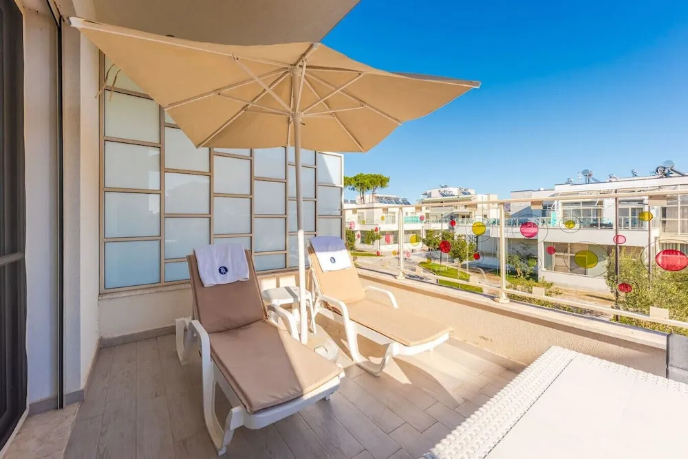 Spacious 1BR Apartment With Resort Access