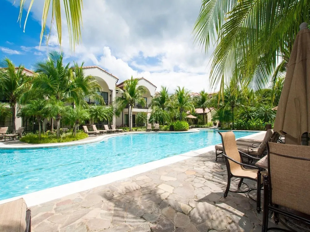 Luxe! Impressively designed 2nd-floor unit in Coco done in red and orange hues