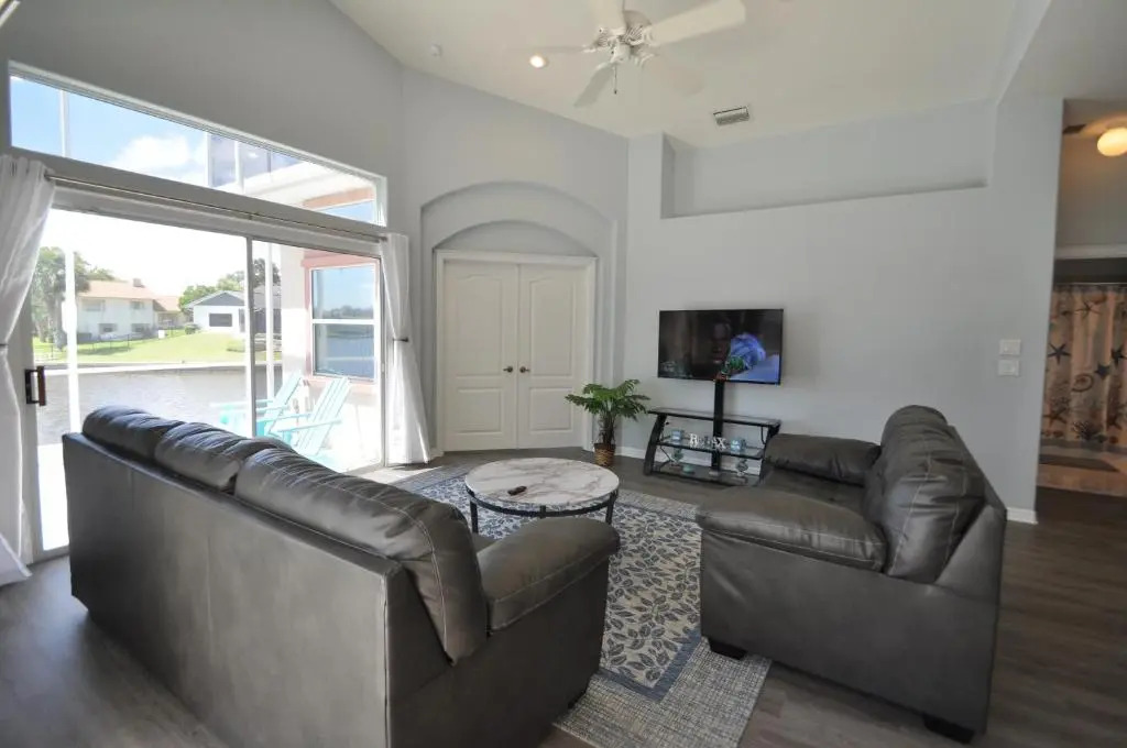 Sunset Bay Beautiful Pool Home - Bring Your Boat or Jet Ski - Canal with Dock- Sleeps 10 - 4 BD