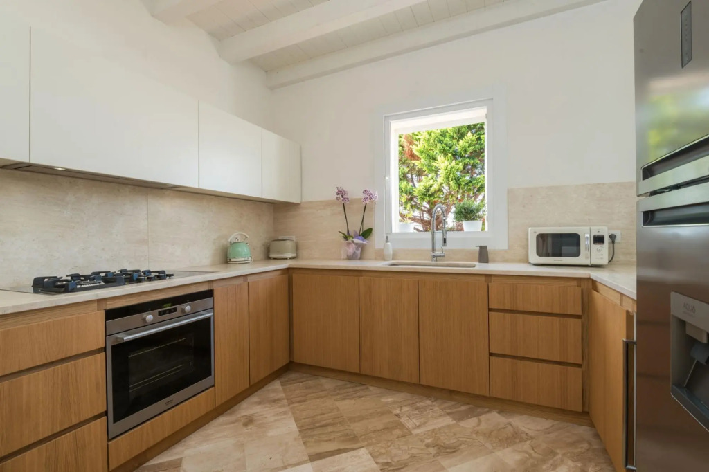 It features a large living area with fully equipped open kitchen and access to the covered terrace d-S'ABBA 1