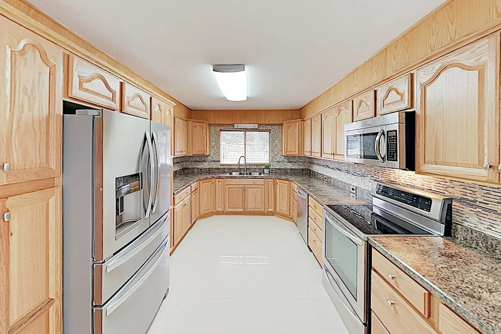 New Listing! Updated W/ Caged Pool & Patio 4 Bedroom Home