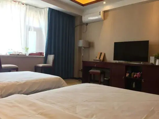 Mangshi Huayou Business Hotel